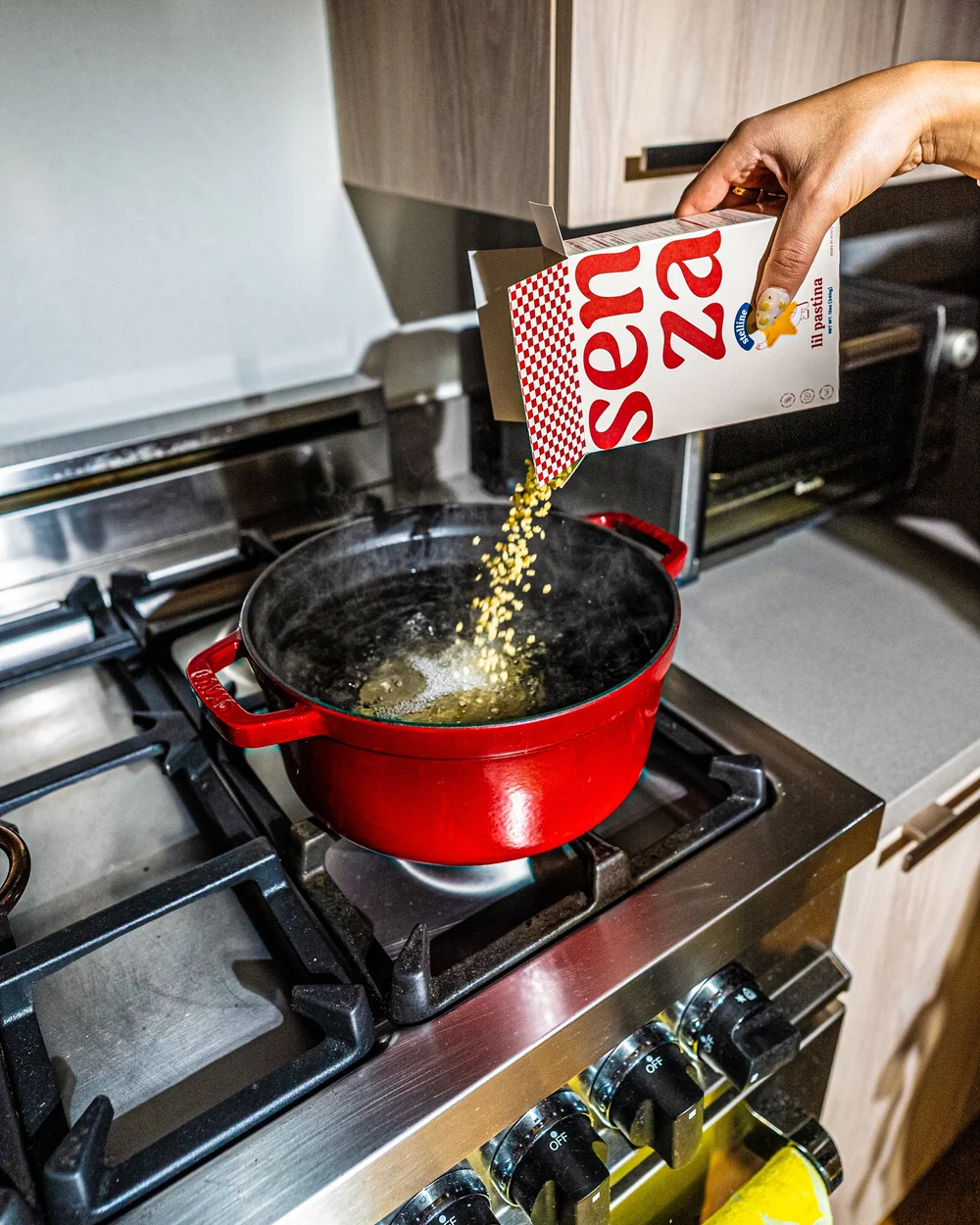 Pouring Eat Senza pasta into pot